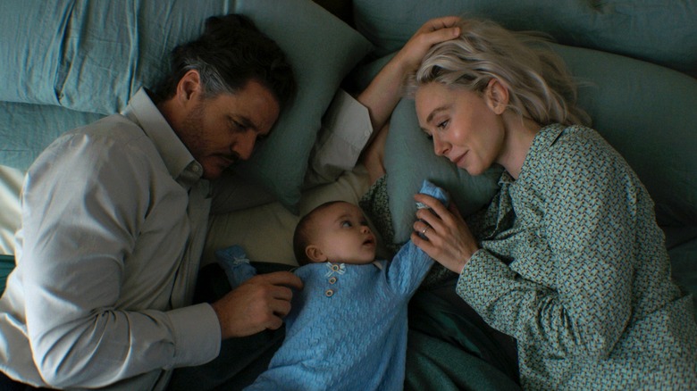 Reed, Sue, and Franklin lying in bed together in The Fantastic Four: First Steps