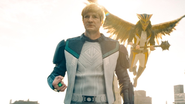 Guy Gardner standing in front of Hawk Girl