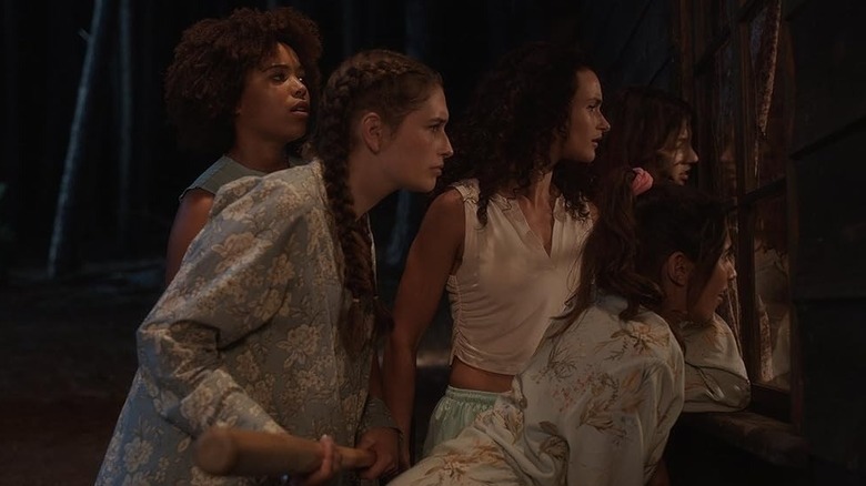 Five women peering through a window in Slumber Party Massacre (2021)