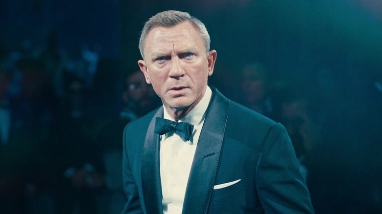 Daniel Craig as Bond looking on