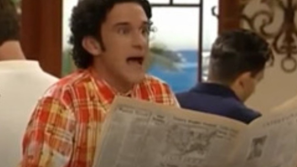 Dustin Diamond reads a newspaper