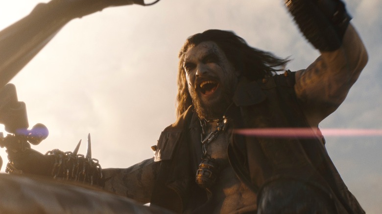 Lobo grinning on his motorcycle in 