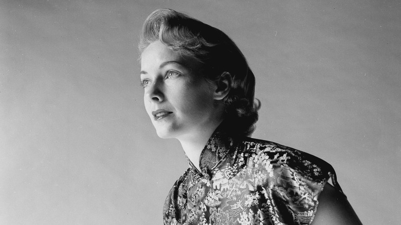 Vera Miles leaning wearing dress