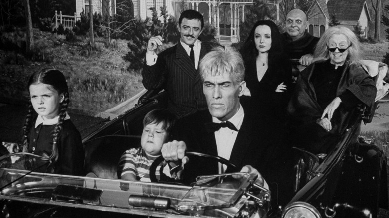 The Addams Family in a car