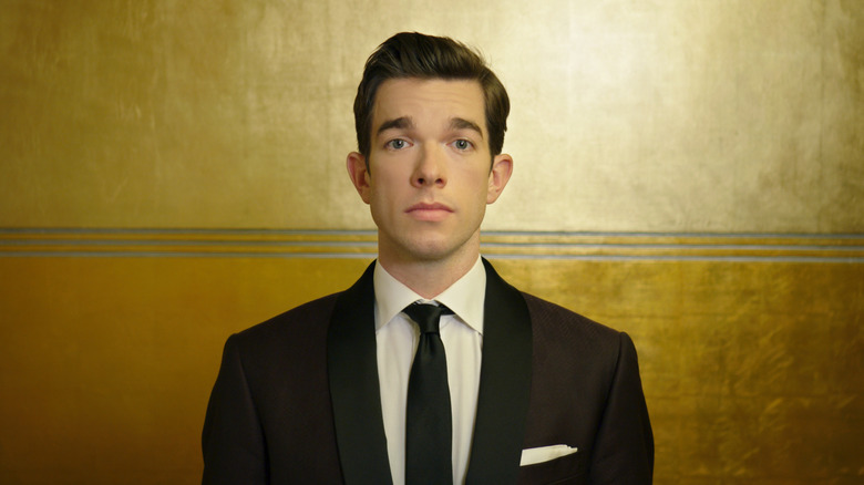 John Mulaney staring at the camera in 