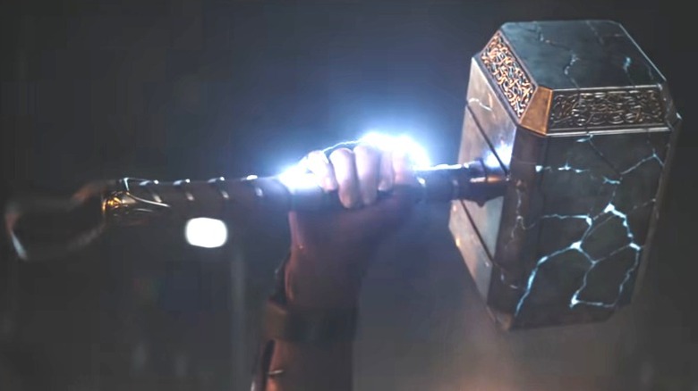 Jane's hand holding hammer