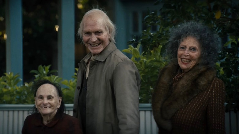 Three old people grinning ominously in Insidious: Out of the Further
