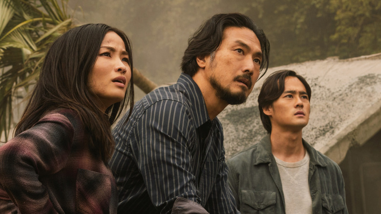 Cate, Kentaro, and Hiroshi Randa running science tests in the jungle in Season 2 of 