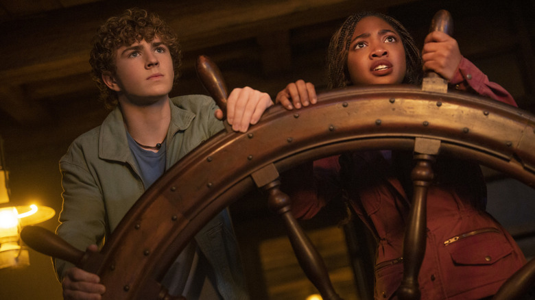 Percy and Annabeth holding a ship wheel in "Percy Jackson and the Olympians"