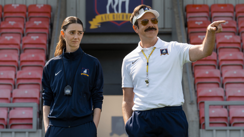 Ted coaching practice at Nelson Road alongside a female coach in Ted Lasso season 4 (2026)