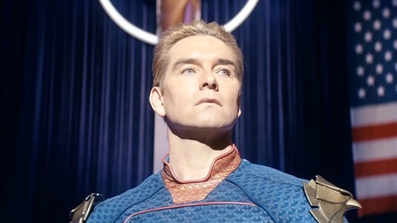 Homelander standing in front of the American flag in The Boys