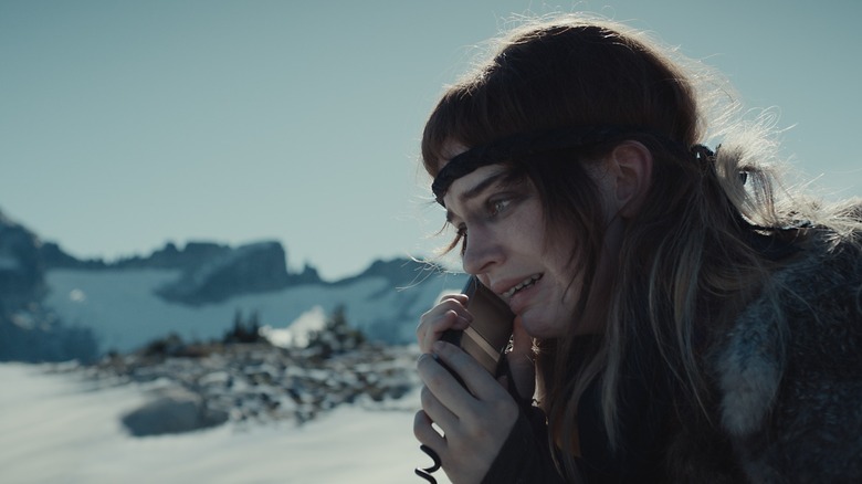 Natalie making a call with the satellite phone crying in Yellowjackets