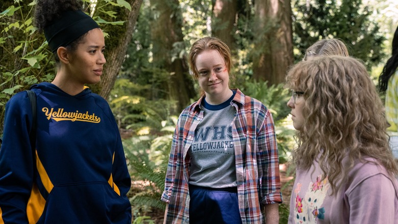 Tai Van and Misty talking in the woods in Yellowjackets