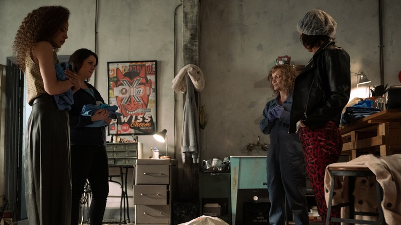 Taissa Shauna Misty and Nat standing around a dead body in Yellowjackets