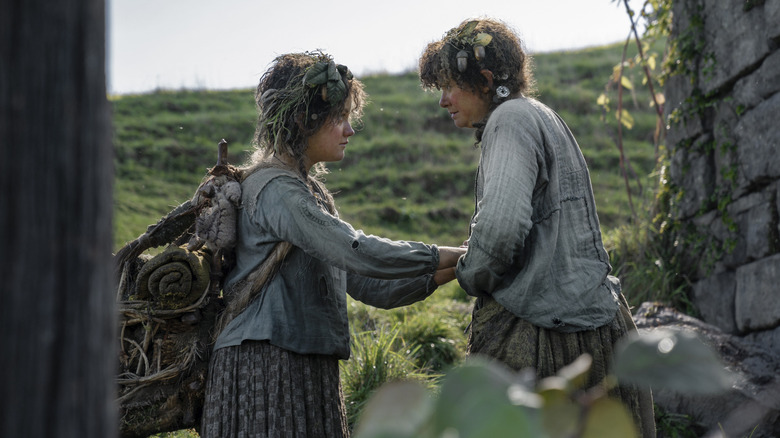 Nori and Poppy hold hands in Season 1 of "The Rings of Power" (2022-present)