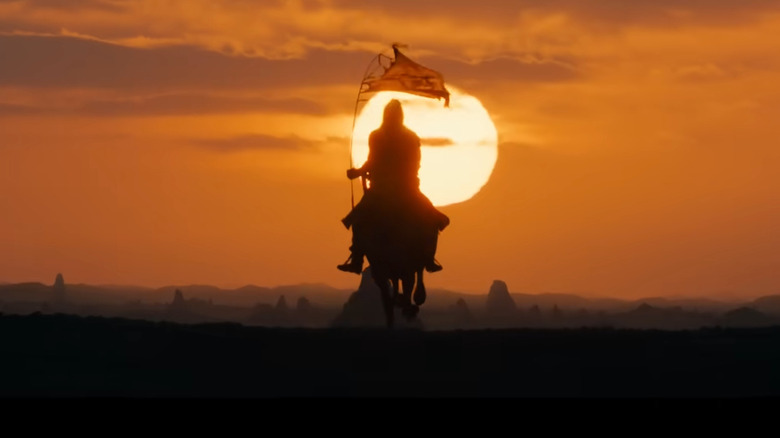 A rider in Rhûn in the sunset in Season 2 of "The Rings of Power" (2022-present)