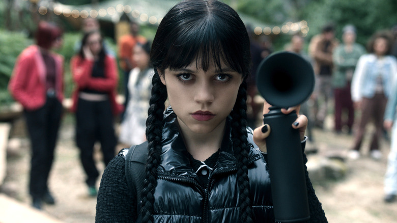 Wednesday Addams holding an air horn on 
