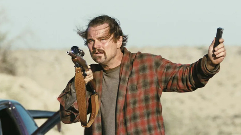 Bob Ferguson brandishes a gun in "One Battle After Another"