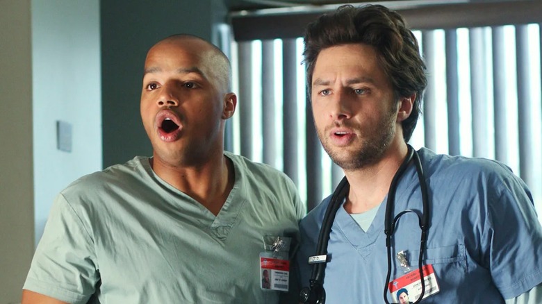 Turk and JD looking surprised at something on Scrubs