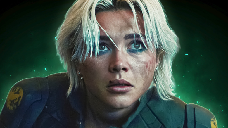 Yelena Belova looking concerned in front of green background