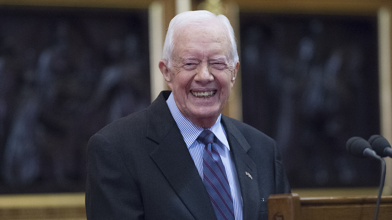 Jimmy Carter smiling at podium