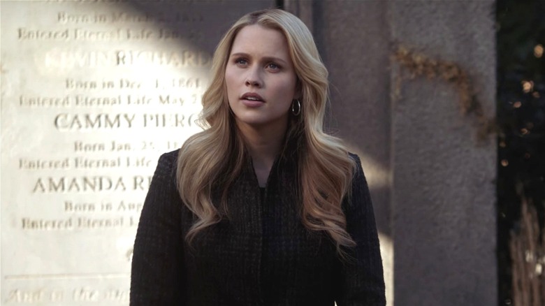 Rebekah standing in a cemetary