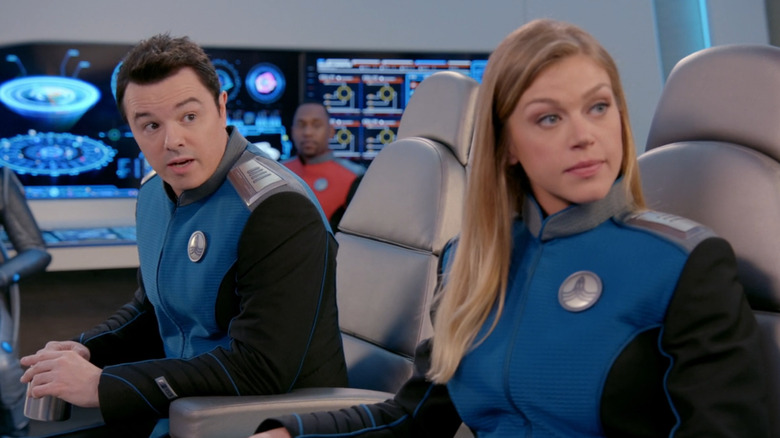 Seth MacFarlane and Adrianne Palicki sitting