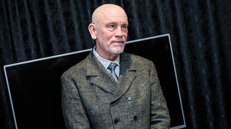 John Malkovich posing at a film festival