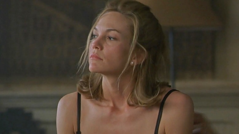 Diane Lane sits up in bed in Unfaithful