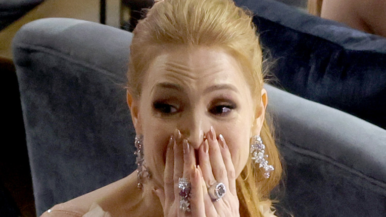 Jessica Chastain hands on face