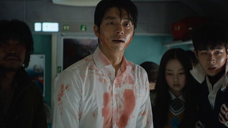 Blood-covered people on train