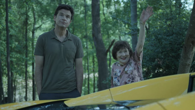 Ozark Sue standing by car