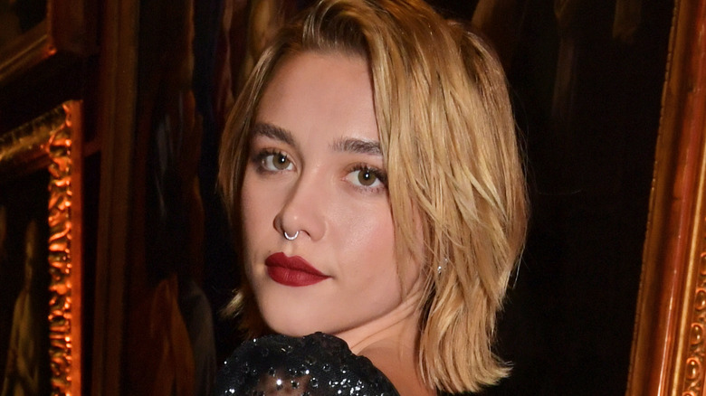 Florence Pugh staring ahead