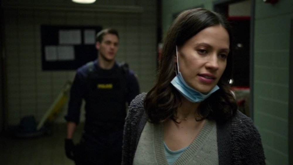 Katie (Kristen Gutoskie) wears a surgical mask on Containment