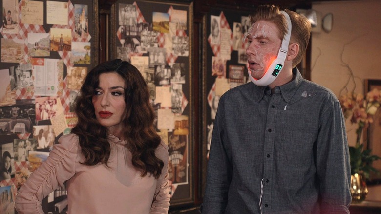 Esmeralda and Ned (with a peeling face and a jaw-defining device wrapped around his head) watching Mare (off camera)
