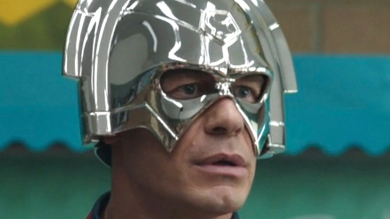 Peacemaker wears shiny silver helmet