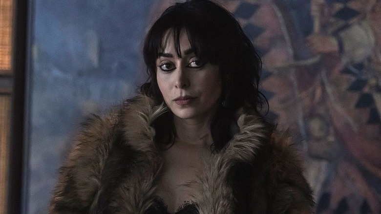 Sofia wearing big fur coat in 