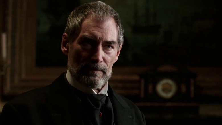 Sir Malcolm in black suit
