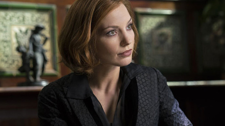 Catriona sitting down in black suit