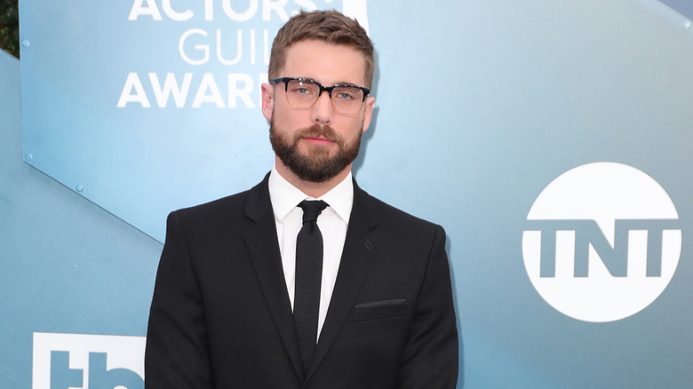Dustin Milligan poses at TNT event 