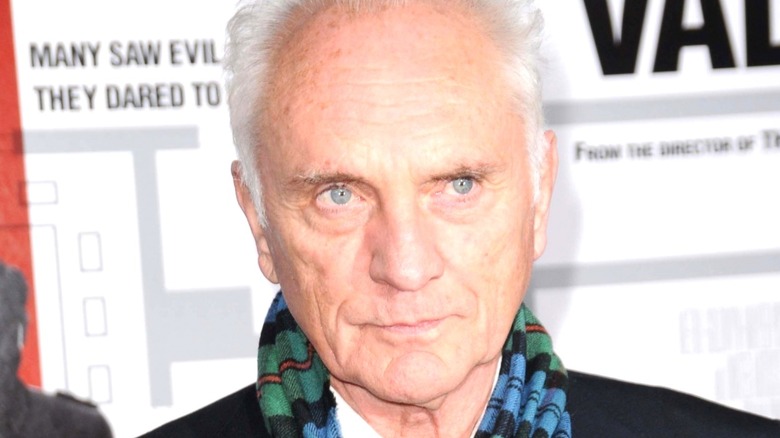 Terence Stamp posing for cameras