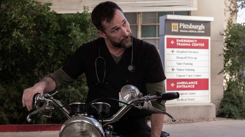 Robby on a motorcycle in the ambulance bay on The Pitt