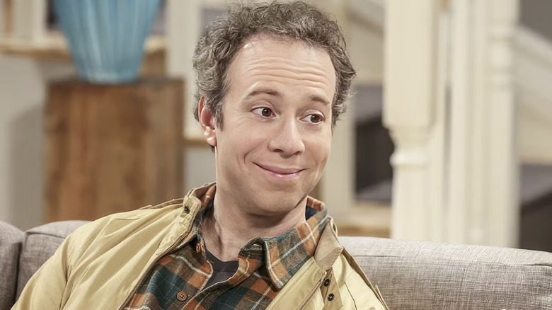 Stuart smiles at someone in 