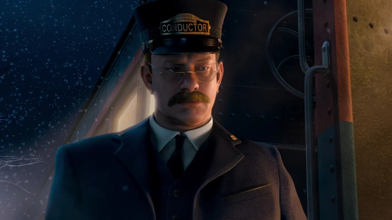 Conductor standing by Polar Express