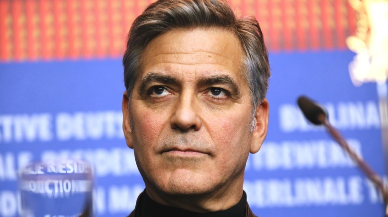 George Clooney staring grimly