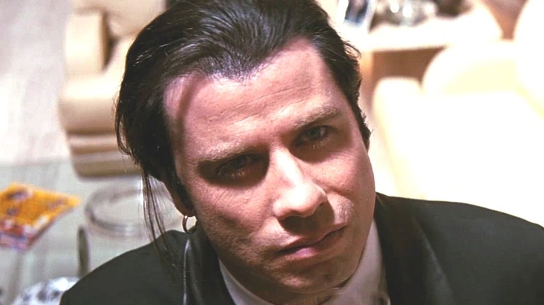 Vincent Vega scowling