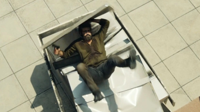 Frank Castle falling onto a metal crate in The Punisher: One Last Kill