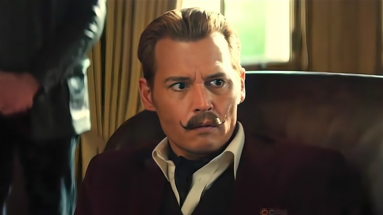 Mortdecai wearing a scarf
