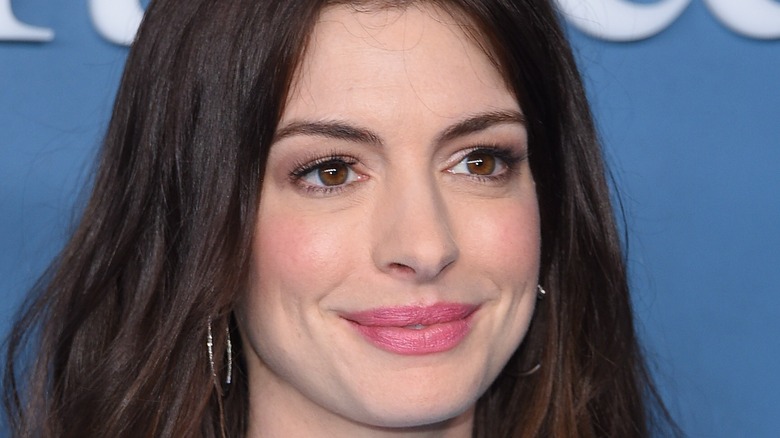 Anne Hathaway smiling at event