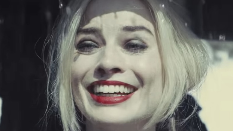 Harley Quinn smiling in the rain